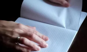 Pulling a Paper Under a Book